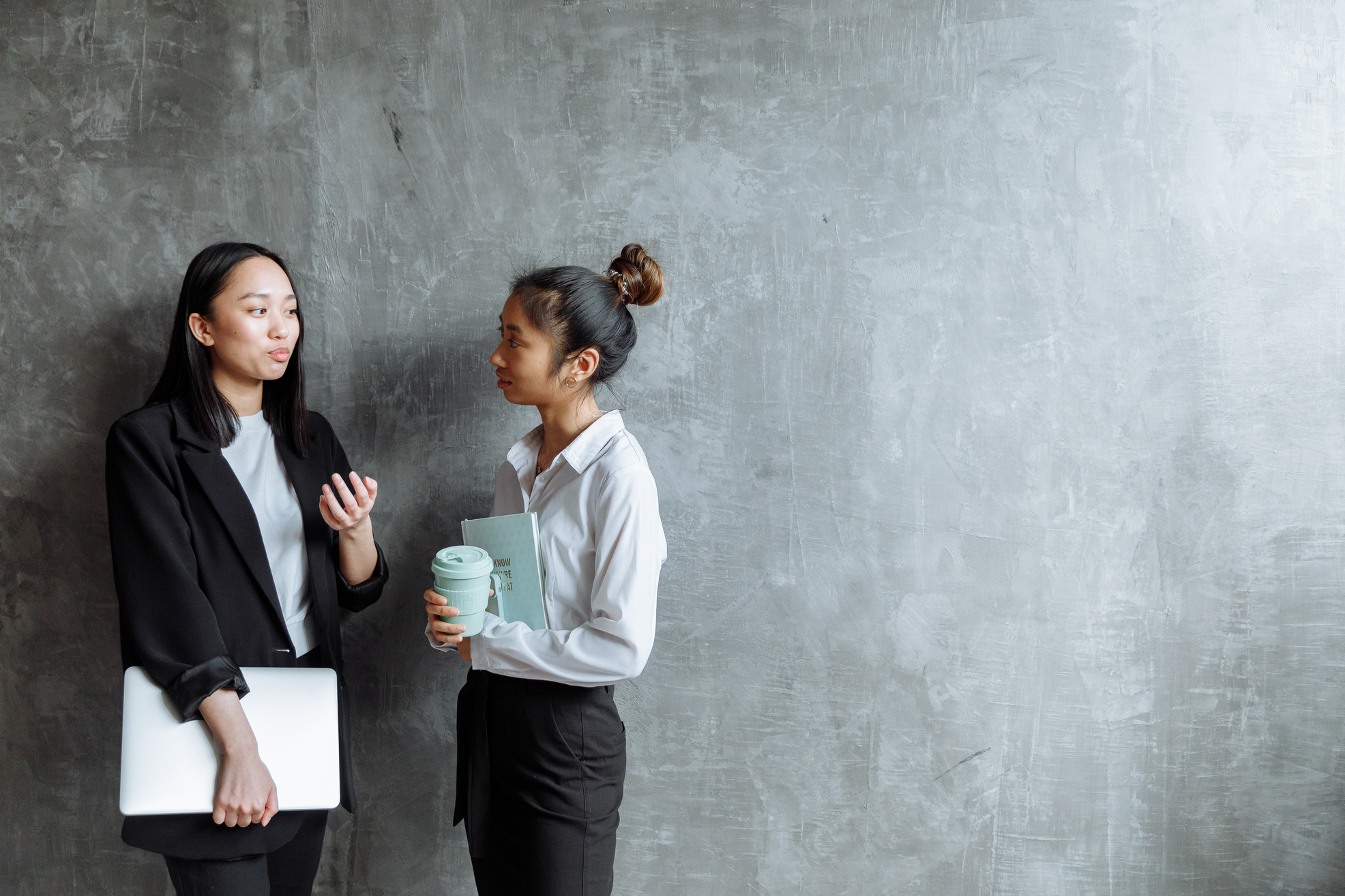 Women Discussing While Standing